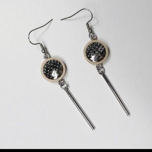 Handmade earrings on wood base scales design